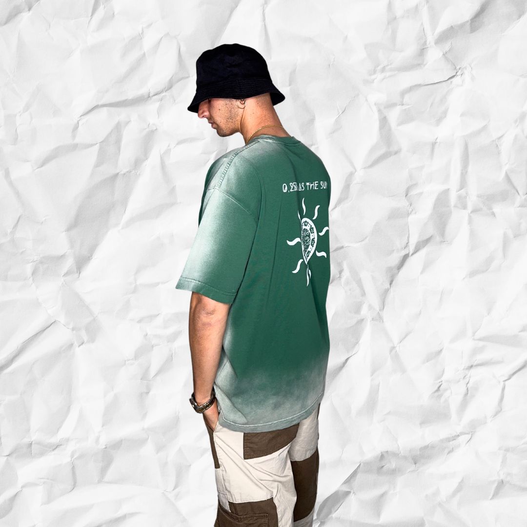 Back and side angle of the DALTONICO Hyperreal Sun Tee displaying both the printed RGB code and hand-drawn sun symbol in white on green fade cotton.
