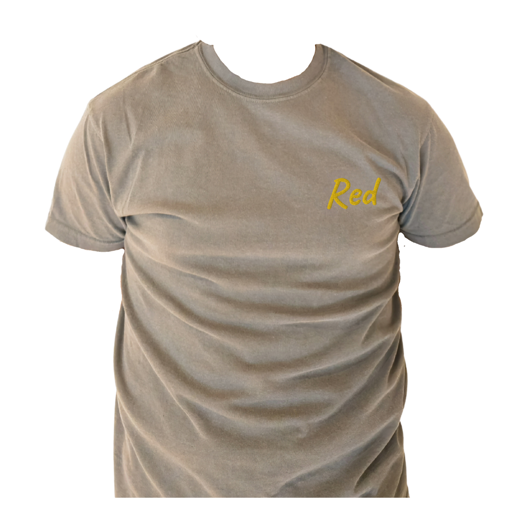 A Gray half sleeve T-shirt with the word 'Red' embroidered in Yellow on the left chest, shown on a transparent background to highlight the detailed design and fit. This premium cotton T-shirt is designed for casual comfort and a modern look, ideal for showcasing unique style.